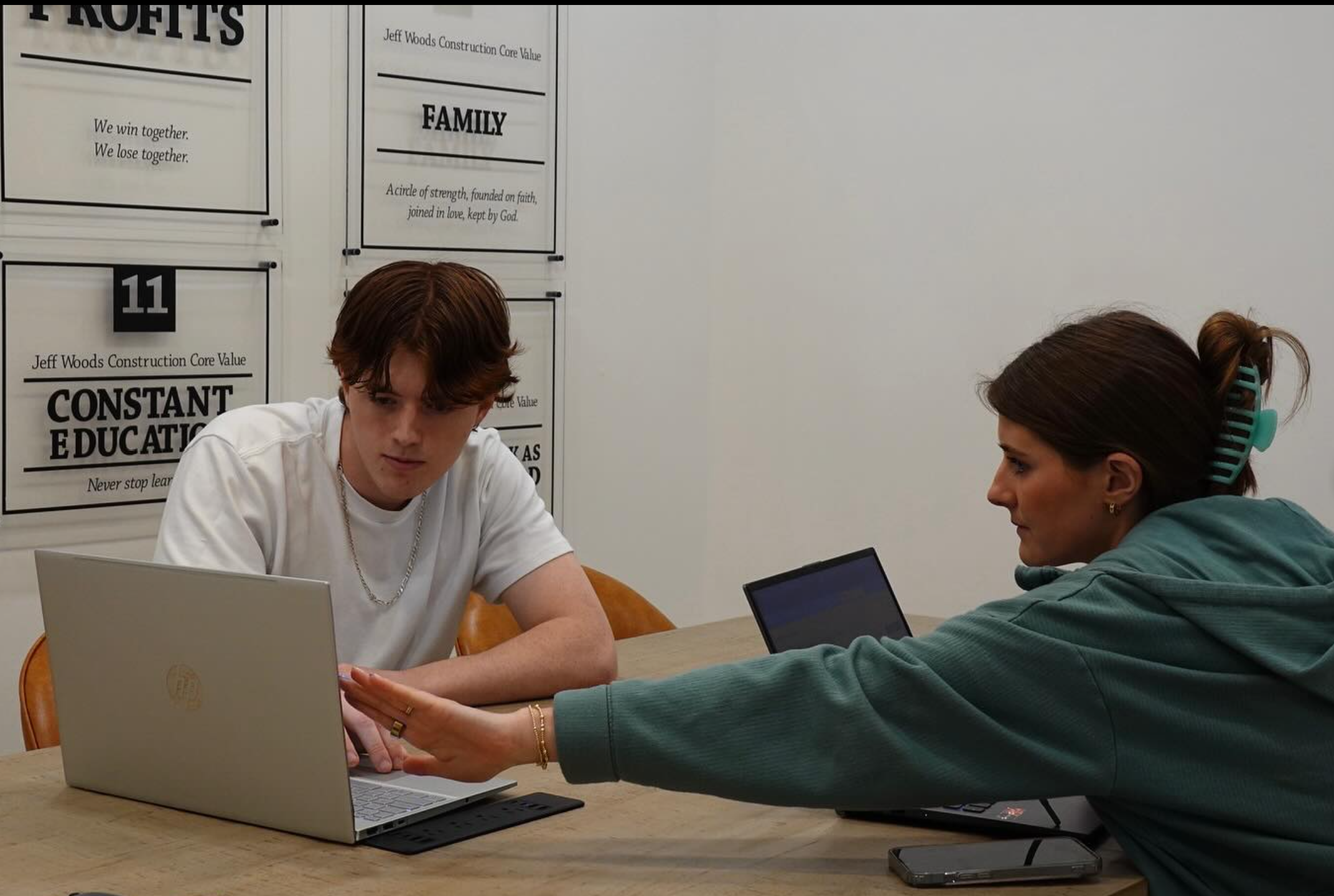 Carter Wiley with a client on a home service job site